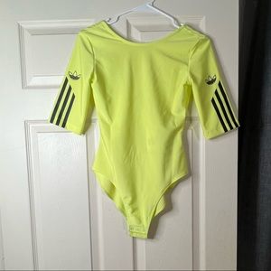 A neon yellow Adidas bodysuit.
